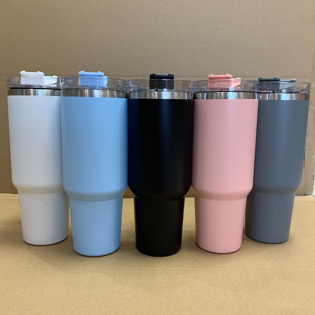 40oz insulated tumblers displayed in multiple color options.