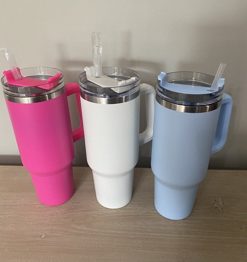 Side profile of 40oz insulated travel mug with reusable straw.